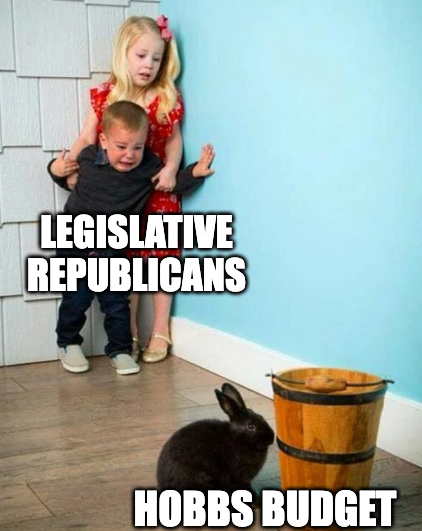 two small children, labeled "legislative Republicans," terrified of a bunny rabbit and bucket, labeled "Hobbs budget"