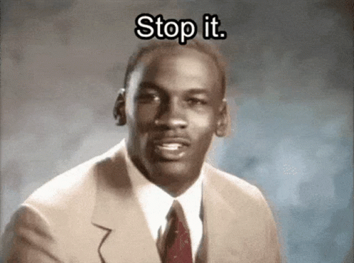 a young Michael Jordan wearing a suit and tie, saying "Stop it. Get some help."